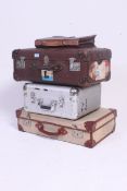 A stack of trunks to include leather with white star label, metal contemporary, two tone 1950's etc.