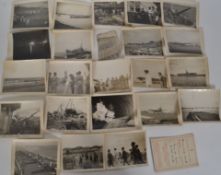 A rare and unusual set of black and white photographs relating to the fall of Singapore 1945
