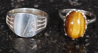 Two white metal ladies rings, one stamped ' silver ' the other unmarked.