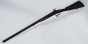 A Victorian twelve bore side by side double barrel  hammer sporting percussion pin fire shotgun.