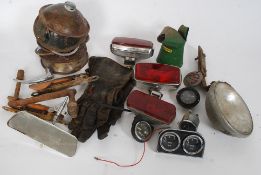 A collection of vintage car parts to include light fittings, rear view mirror,