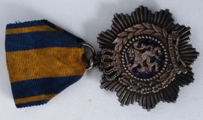 A 19th century Dutch military medal - 1893 Star for Loyalty and Merit with motto Trow en Verdienste