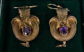 A pair of gilded silver ( tested ) Victorian amethyst stone set scroll worked earrings.