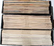 A collection of vintage Vogue Pattern magazines, all housed within albums.