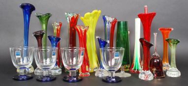 A large collection of studio glass vases some examples by Murano along with four glass drinking
