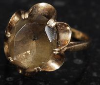 A 9ct gold and citrine stone ladies dress ring having flower style mount. Total weight 3.