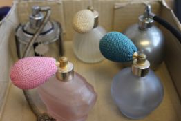 A collection of vintage ladies perfume atomisers to include peach glass, white metal,