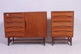 A good 1970's retro teak sideboard chest being raised on tapered supports with drawers and cupboard