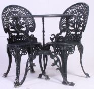 A 20th century cast metal Coalbrook-Dale style garden table and chairs