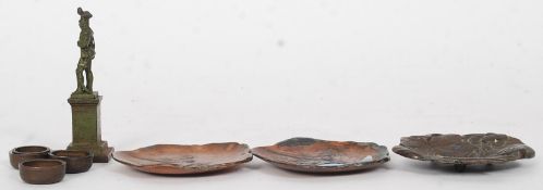 A collection of small metal items to include unusual small dishes made from old coins (mostly