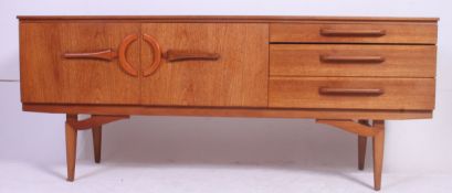 A vintage retro mid 20th century teak wood sideboard having 3 drawers to the right with drop down