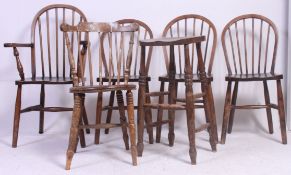 A group of Windsor dining chairs along with a vintage turned stool.