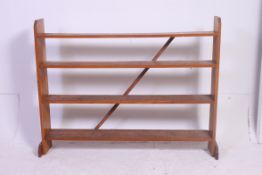 A good large solid golden oak open window library bookcase raised on plinth feet having fixed