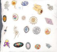 A collection of vintage  and contemporary ladies dress brooches to include silver, enamel set,