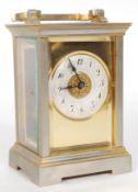 A brass cased French carriage clock, with viewing panels to all sides,