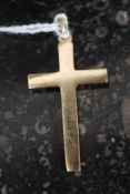 A 9ct gold hallmarked necklace crucifix with loop above. Total weight 4.