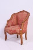 A French contemporary Louis XV style armchair having shaped beechwood show wood frame being
