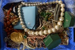 An extensive collection of costume jewellery  to include Estee Lauder, pearls.