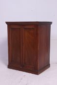 An Edwardian mahogany pedestal music cabinet.