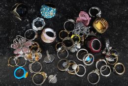 A collection of silver and white metal ladies dress rings to include pearl, paste stone, enamel set,