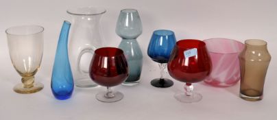 A collection of studio glass to include goblets and other items.