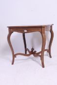 An Edwardian rosewood and marquetry inlaid centre table in the manner of Edwards & Roberts.
