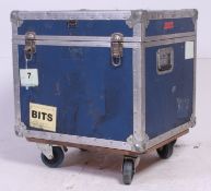 A retro 20th century trunk /speaker amp chest on wheels.