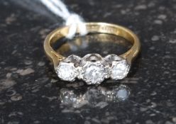 A vintage 18ct gold 3 stone diamond ring. Each diamond bezel mounted approx .10pnts each.