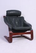 A vintage Danish leather and bentwood cantilever armchair having rosewood effect frame with green