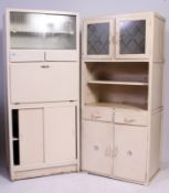 A retro upright 1950's kitchen dresser cabinet having fall front with drawers and cupboard together