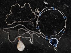 A  good ladies contemporary silver necklace having a quartz inset teardrop pendant.