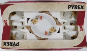 An boxed unused 18 piece Pyrex tea service in the Autumn Glory pattern along with a boxed set of