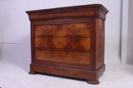 A 19th century French walnut chest of drawers having bracket feet with a series of blind fronted