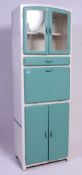 A retro 1950's two tone kitchen dresser cabinet having fall front with cupboard above.