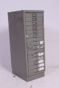 TORAGE CABINET - a Bisley steel office equipment storage cabinet 15 drawer raised on plinth