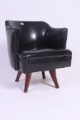 A 20th century black faux leather office swivel desk chair.
