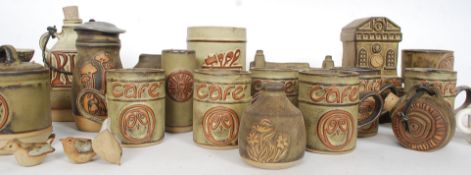 A good collection of Tremar studio pottery items to include kitchen canisters, jugs, pots,