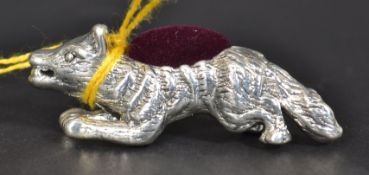 A white metal 925 ( indicating silver ) pincushion in the form of a fox.