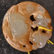 A 20th century carved jade pendant