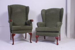 A pair of contemporary Georgian style mahogany matching fireside / wingback chairs in matching