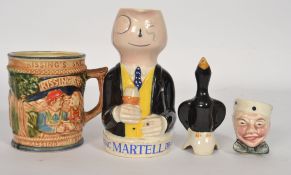 A 1950`s Cognac Martell Brandy advertising jug modelled as a yellow waistcoated man wearing a