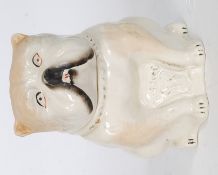 A 19th century ceramic continental tobacco jar in the form of a bulldog with notation to front.