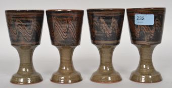 Ray Finch ( British, 1914-2012 ) A set of four studio pottery wine goblets with simple glaze.