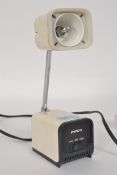 An unusual Pierre Cardin designed Pifco adjustable squared plastic anglepoise desk lamp.