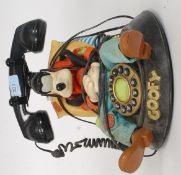 A collectable Disney telephone in the form of a sleeping Goofy