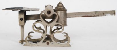 A set of vintage sliding postal scales in brass mounted on a mahogany plinth