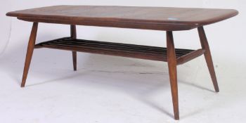 Ercol Golden Dawn elm rectangular coffee table with under-tier, 46cm x 104cm in the Windsor pattern.