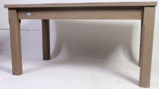 A 1970's upholstered teak wood and painted shabby chic refectory table raised on squared supports