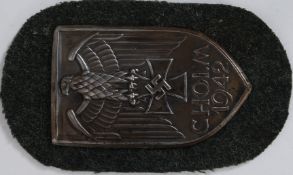 A WW2 Third Reich German Cholm Battle arm shield 1942 on green cloth back depicting Eagle and