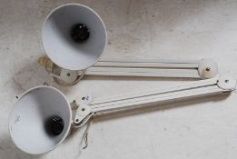 A pair of large contemporary vintage style wall mounted anglepoise lamps by Luxo- both in white
